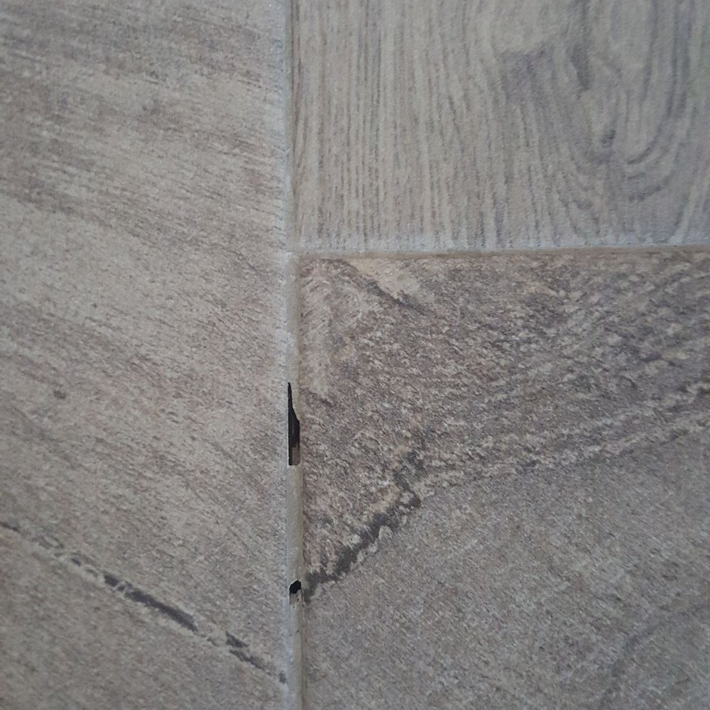 So a few missed spots on the grout no big deal . A tile in a corner wrong way . So a few missed spots on the grout no big deal . A tile in a corner wrong way .