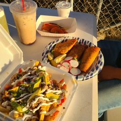 Puras Papas - Loaded fries with carnitas, quesabirria with consume, horchata