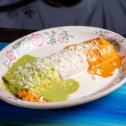 Margaritas North Platte - A plate of Mexican cuisine is served on a vibrant blue table at Margaritas North Platte.