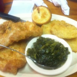 Munchee's Smokehouse - Pork chops, fried green tomatoes, turnip greens and a cornbread muffin.