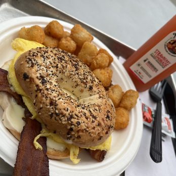 Graze 1910 - Bacon egg and cheese on everything bagel with tots - Breakfast & Brunch Near Me - Tampa, Florida