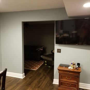 CRL Solutions - a living room with a flat screen tv - General Contractors Near Me