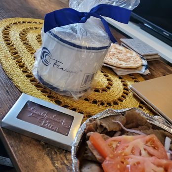 Cross-Rhodes - a plate of food on a table - Greek Near Me - Evanston, Illinois