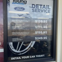 Sign on window at dealership with different price.