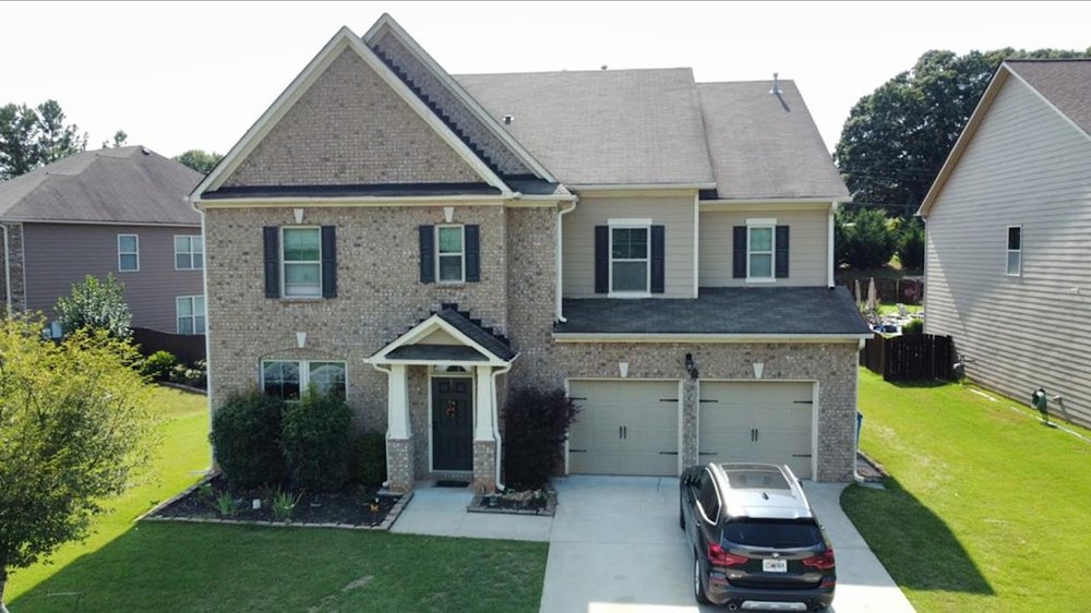 Slide of Maravegias and Sons Roofing and Solar