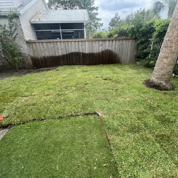 EliteScapes - Freshly laid sod around artificial grass covering a brick patio. - Lawn Services Near Me EliteScapes - Freshly laid sod around artificial grass covering a brick patio. - Lawn Services Near Me