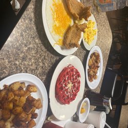 Arline's Restaurant & Seafood - Catfish and grits with potatoes and red velvet Belgian waffle