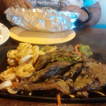 El Molcajete - "Steak and shrimp fajitas for 2". Comes w/ 3 tortillas each, and a PLATE full of sides (Rice, beans, Pico, lettuce, guac... - Mexican Near Me - Lawrenceville, Georgia El Molcajete - "Steak and shrimp fajitas for 2". Comes w/ 3 tortillas each, and a PLATE full of sides (Rice, beans, Pico, lettuce, guac... - Mexican Near Me - Lawrenceville, Georgia