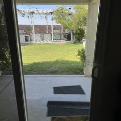 702 Window Washing - Crystal-clear sliding glass door.