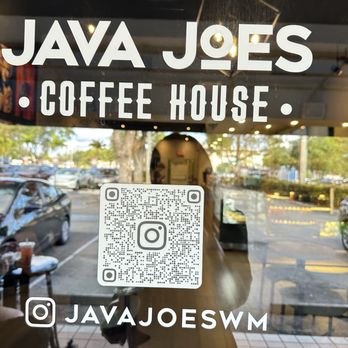 Java Joe's - The image shows a storefront sign for Java Joes Coffee House with a QR code and Instagram handle, set against a glass window reflecting the parking lot and interior. - Coffee & Tea Near Me - Albuquerque, New Mexico