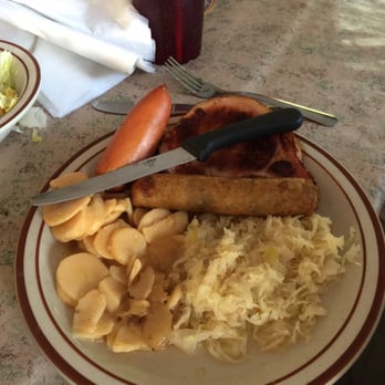 Cafe International - Sample platter two kids of wurst, smoked chop and potatoes - American Near Me - Helen, Georgia Cafe International - Sample platter two kids of wurst, smoked chop and potatoes - American Near Me - Helen, Georgia