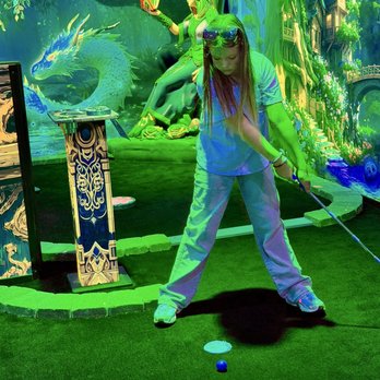 Mythic Minigolf - Granddaughter putting on course 1 - Mini Golf Near Me - Raleigh, North Carolina Mythic Minigolf - Granddaughter putting on course 1 - Mini Golf Near Me - Raleigh, North Carolina