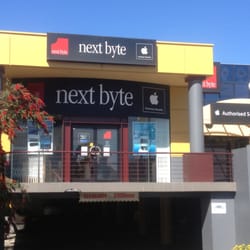 Next Byte - Front of the shop, carpark directly below.