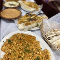 Taste of Yemen - Foreground: white bean egg dish from breakfast menu