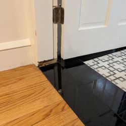 Modern Concepts - Removed beautiful marble threshold, and installed tile much too low (large gap under door and gap in trim