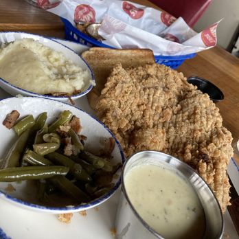 Mia's Table - Chicken fried steak, green beans, mashed potatoes and onion rings. The onion rings were warm and tasty. - American Near Me - Shenandoah, Texas