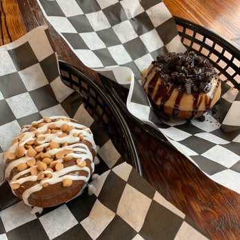 Glazed Over Donuts - Left: Chocolate glaze, marshmallow drizzle, peanut butter chips. Right: peanut butter glaze, chocolate drizzle, Oreo crumble. - Donuts Near Me - Beacon, New York