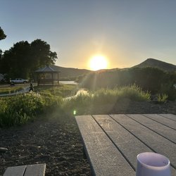 Woods & River Campground - By the river at a picnic table