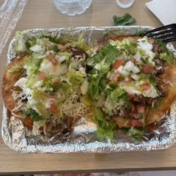 Two tostadas.  One birria and one carnitas.