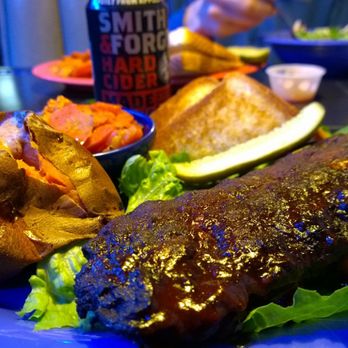 The Blu Pig - half rack of ribs and one of the hard ciders in stock (which is actually on the fruity side) - Barbeque Near Me - Moab, Utah The Blu Pig - half rack of ribs and one of the hard ciders in stock (which is actually on the fruity side) - Barbeque Near Me - Moab, Utah