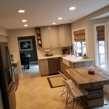 LuckMarble & Cabinets - a kitchen with an island - General Contractors Near Me LuckMarble & Cabinets - a kitchen with an island - General Contractors Near Me