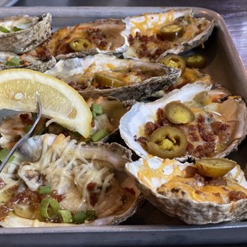 Shuckin' Shack Oyster Bar - Chargrilled Oysters (Jalpeno Cheddar and Parmesan Garlic, both topped with Bacon) super tasty but small. - Seafood Near Me - Cumming, Georgia Shuckin' Shack Oyster Bar - Chargrilled Oysters (Jalpeno Cheddar and Parmesan Garlic, both topped with Bacon) super tasty but small. - Seafood Near Me - Cumming, Georgia