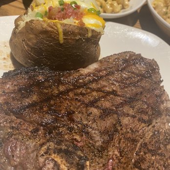 Outback Steakhouse - Porterhouse Steak and loaded baked potato - Steakhouses Near Me - Orlando, Florida Outback Steakhouse - Porterhouse Steak and loaded baked potato - Steakhouses Near Me - Orlando, Florida