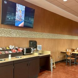 Market Basket - Eat in area w condiments, utensils, sink, microwave, tables and TVs. Great option for lunch. Grab some premade food and heat up.