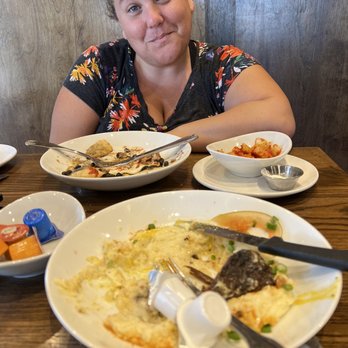 Another Broken Egg Cafe - Grits and short ribs. Huevos Rancheros side potatoes - American Near Me - Austin, Texas Another Broken Egg Cafe - Grits and short ribs. Huevos Rancheros side potatoes - American Near Me - Austin, Texas