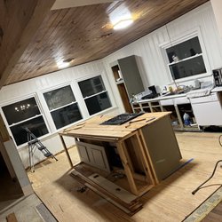 Southern Hospitality Roofing & Remodeling - Custom island with recessed stove in the middle of the island inside kitchen