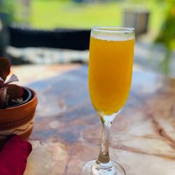 Mimosa Brunch Farm to Table - Freshly squeezed Passion fruit mimosa.