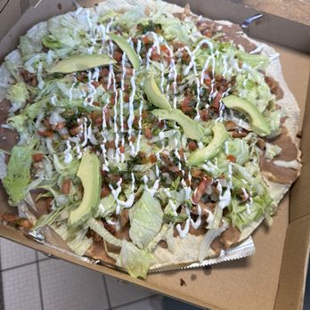 Authentic Taquería - I don't know this is called, I just point to the picture but my oh my is it good! It's a taco pizza - Tacos Near Me - Snellville, Georgia Authentic Taquería - I don't know this is called, I just point to the picture but my oh my is it good! It's a taco pizza - Tacos Near Me - Snellville, Georgia