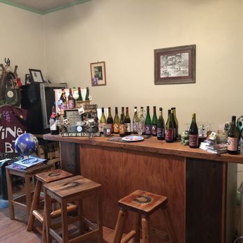 Reid's Livery - a bar with a lot of bottles on it - Wineries Near Me - Alvaton, Kentucky