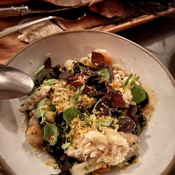 Jacqueline - Black squid ink udon with crab, calamari, shrimp and chili crisp butter - Cocktail Bars Near Me - Portland, Oregon Jacqueline - Black squid ink udon with crab, calamari, shrimp and chili crisp butter - Cocktail Bars Near Me - Portland, Oregon