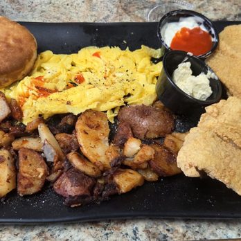 Woodsby's Cafe - 2 egg breakfast with catfish and seasoned red potatoes with a large fresh biscuit and gravy. All from scratch - Breakfast & Brunch Near Me - Kissimmee, Florida