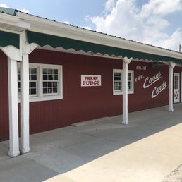 a red building with a green awning