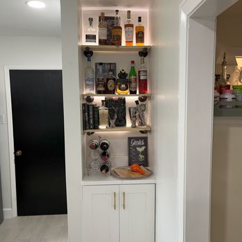 True Electric Services - LED lights behind bar shelves - Electricians Near Me