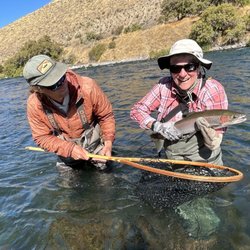 Fly & Field Outfitters - My cousin with one hand landed this fiesty steelhead!