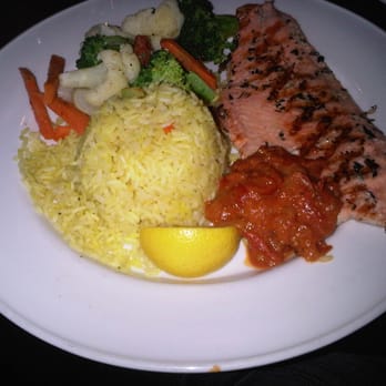 Hemingway's Restaurant - Rosemary Trout with tomato relish and vegetable rice - Bars Near Me - Toronto, Ontario