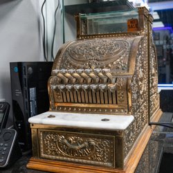 Downtown Cuts - Old school cash register from the early 1900s