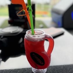 Berry Bash (vodka, gin, blackberry, citrus) in souvenir golf bag cup | $26