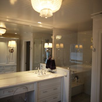 KTtiles - a woman taking a picture in a bathroom - General Contractors Near Me KTtiles - a woman taking a picture in a bathroom - General Contractors Near Me