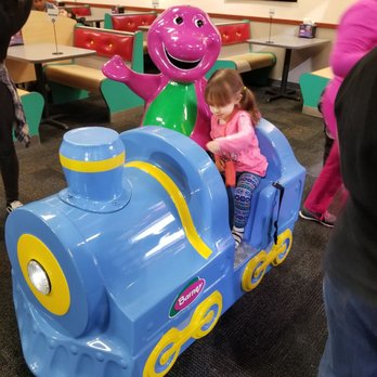 Chuck E. Cheese - a little girl riding a toy train - Pizza Near Me - Fayetteville, North Carolina Chuck E. Cheese - a little girl riding a toy train - Pizza Near Me - Fayetteville, North Carolina
