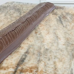 a chocolate cake on a marble table