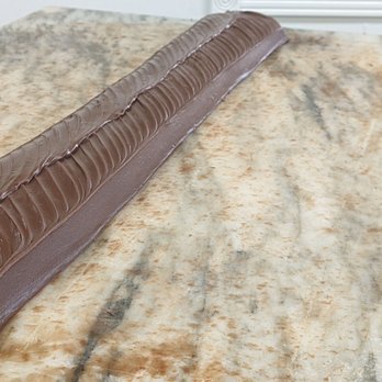 Joann's Fudge - a chocolate cake on a marble table - Candy Stores Near Me - Mackinac Island, Michigan