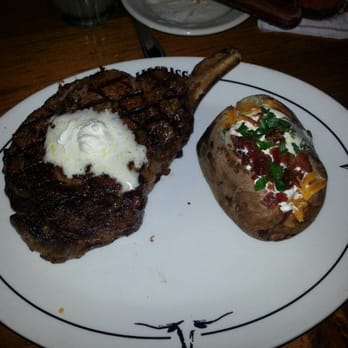 Saltgrass Steak House - don't know if it is an optical illusion.  The baked potato was big. - Steakhouses Near Me - Irving, Texas