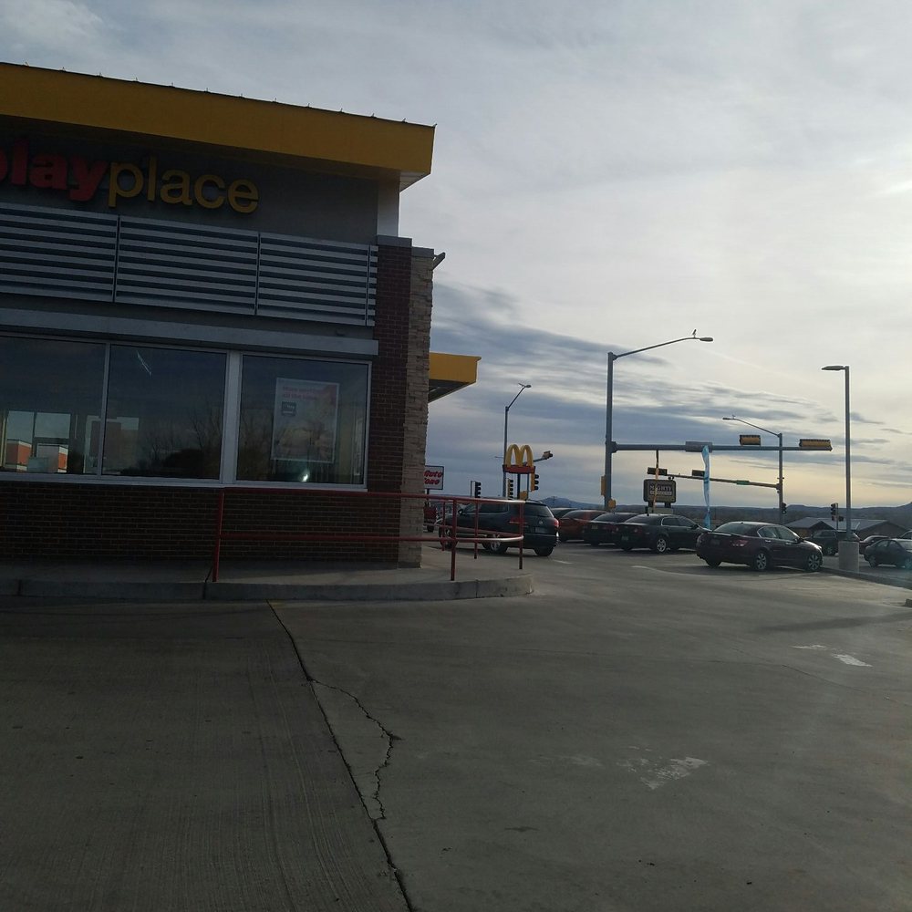cars parked in front of a mcdonald's