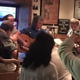 The musicians sit near the front window, so the booths opposite them are prime real estate