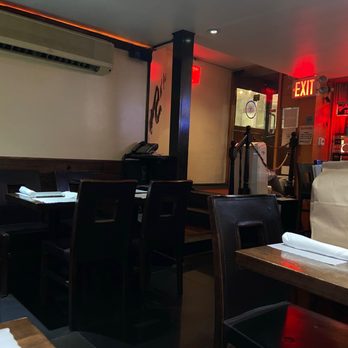 Spice Symphony - Lexington - a restaurant with tables and chairs - Indian Near Me - New York, New York Spice Symphony - Lexington - a restaurant with tables and chairs - Indian Near Me - New York, New York