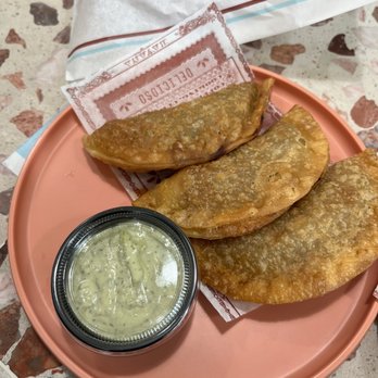 Colada Shop - Picadillo (beef) Empanada with that green sauce - so so goood! Wonderful snack! - Coffee & Tea Near Me - Washington, DC, District of Columbia